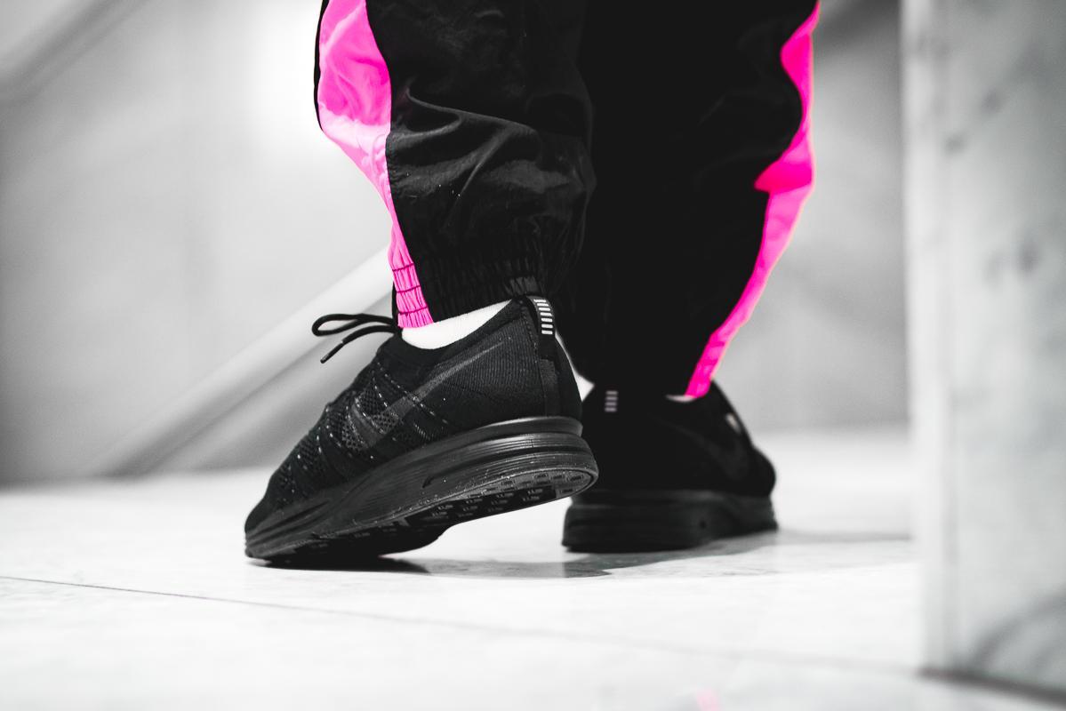 all black flyknit trainers