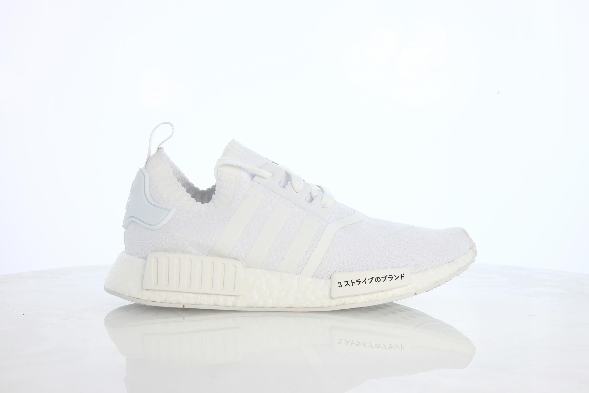 Adidas primeknit nmd triple white best sale