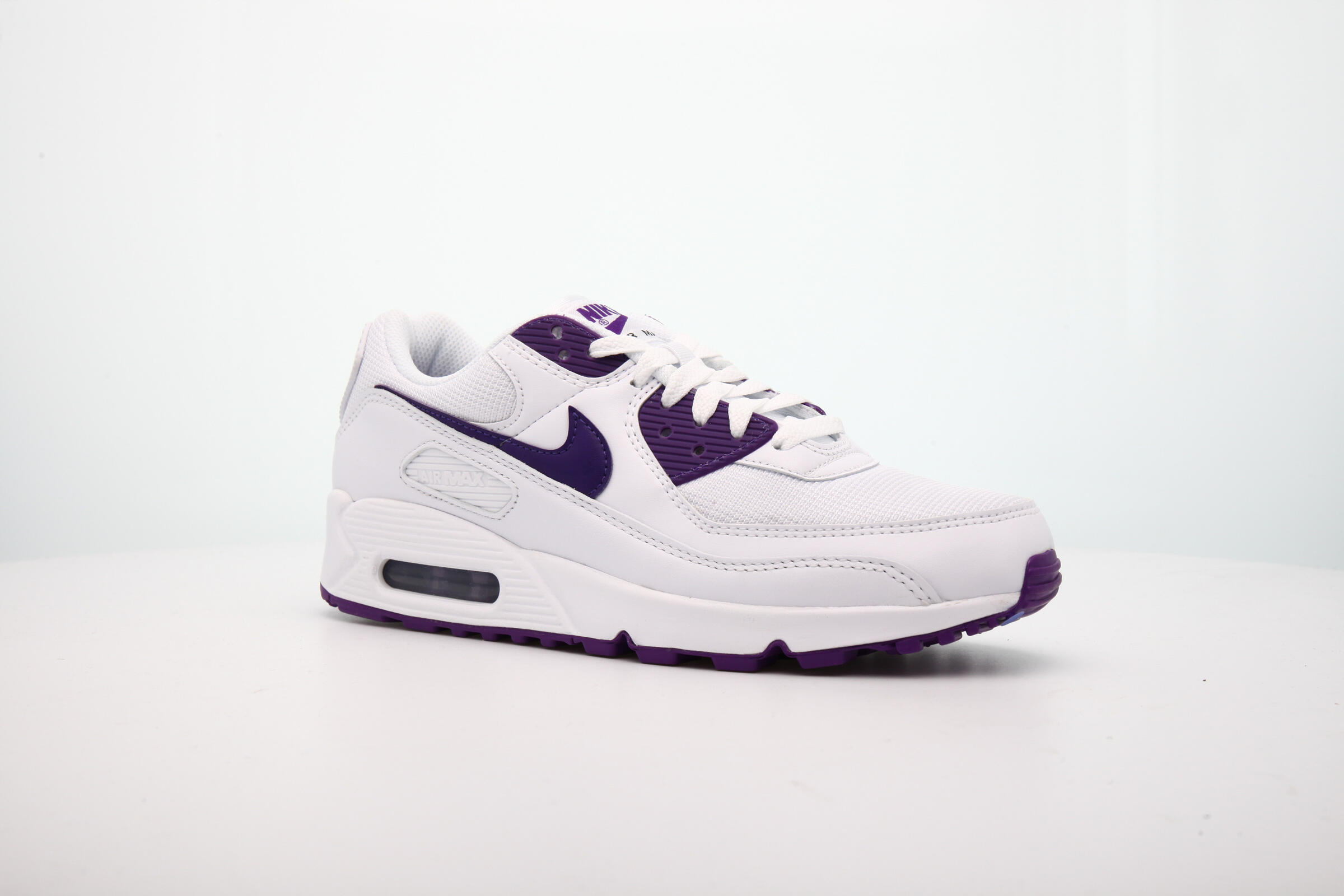 white and purple nikes