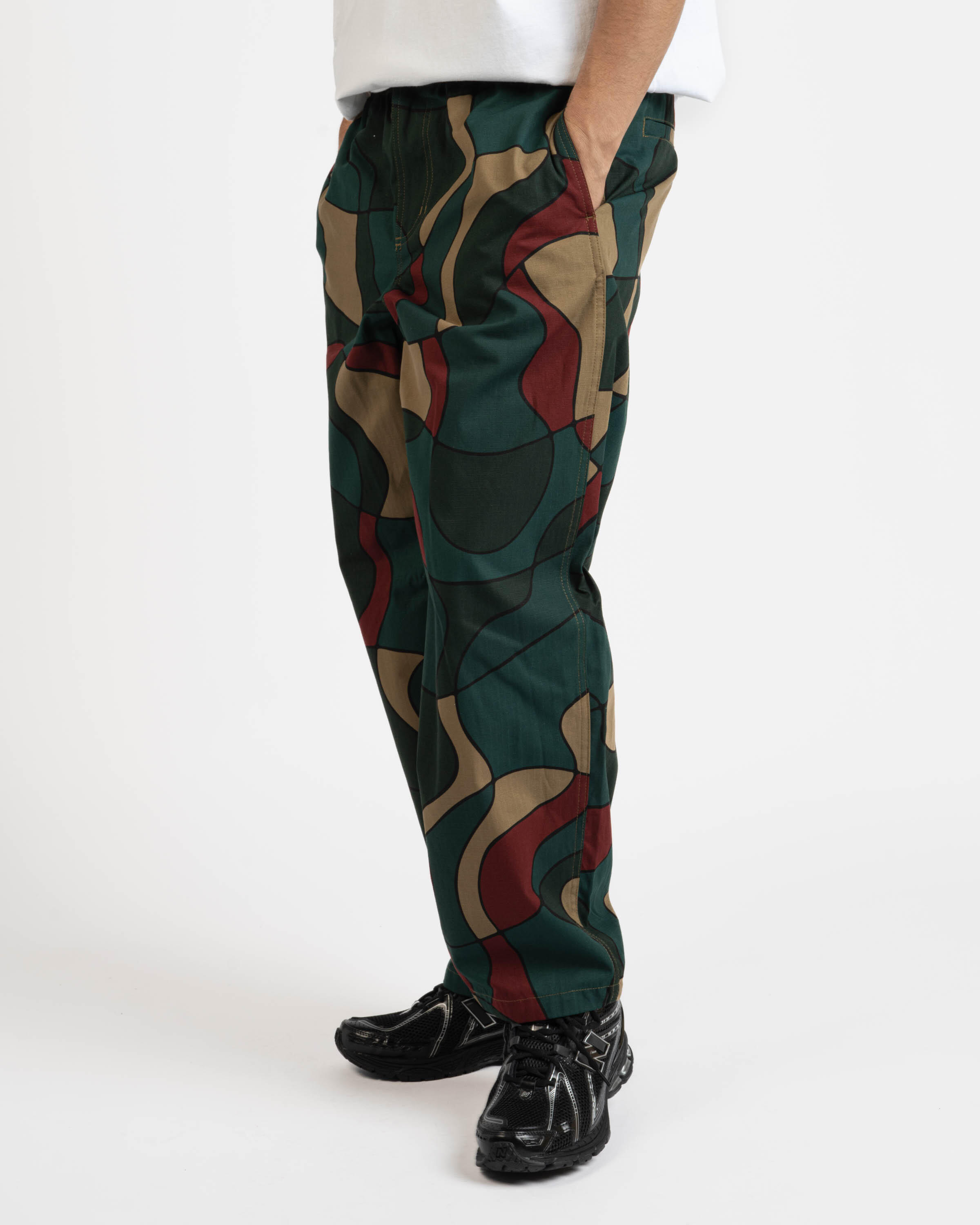 by Parra trees in wind relaxed pants